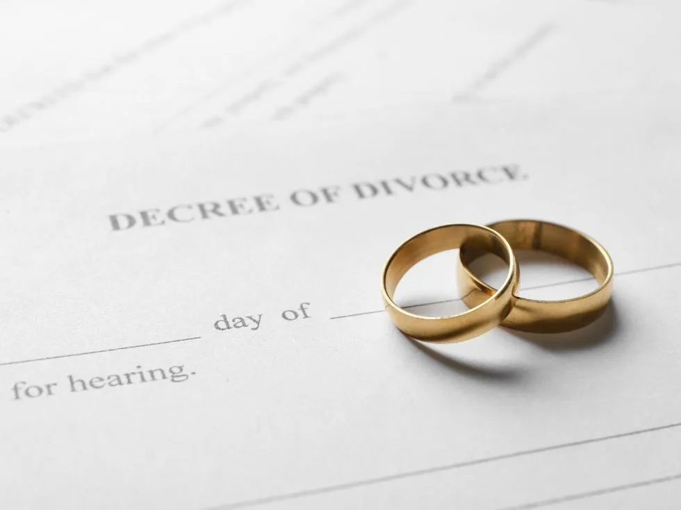 Decree of Divorce document with 2 rings on top.